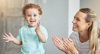 Buy stock photo Happy clapping, mother support and child with energy in living room, smile for celebration and family love in lounge of house. Portrait of a baby with hands applause while playing with mom in home