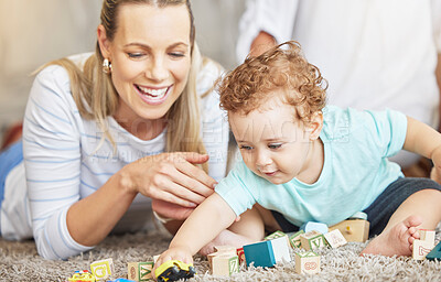 Buy stock photo Mother, kid and play learning block toys on floor for educational bonding time together in family home. Young, caring and loving woman helping toddler with child development and coordination skills.