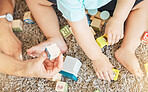 Baby kids hands, building blocks and play learning for fun, education and healthy motor skills development on home carpet floor. Above closeup, parent and child playing with creative toys and games