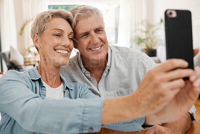Buy stock photo Senior couple taking selfie with phone, smile in love with 5g and technology for social media in marriage at house. Happy, married and smiling man and woman streaming, communication or video call