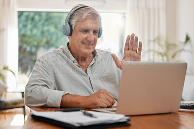 Buy stock photo Video call, laptop and wave with a senior businessman chatting online with headphones and a computer at home. Conference, internet and communication with a mature male employee remote working