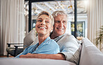 Love, couple and retirement with a senior woman and man on a sofa to relax in their home together. Happy, smile and thinking with an elderly male and female pensioner in the living room of a house
