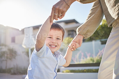 Buy stock photo Portrait of a child in the street with mom holding hands and playing together. Mother and her kid having fun outside, in summer and the child is happy and smiling. Love, family and bonding with son