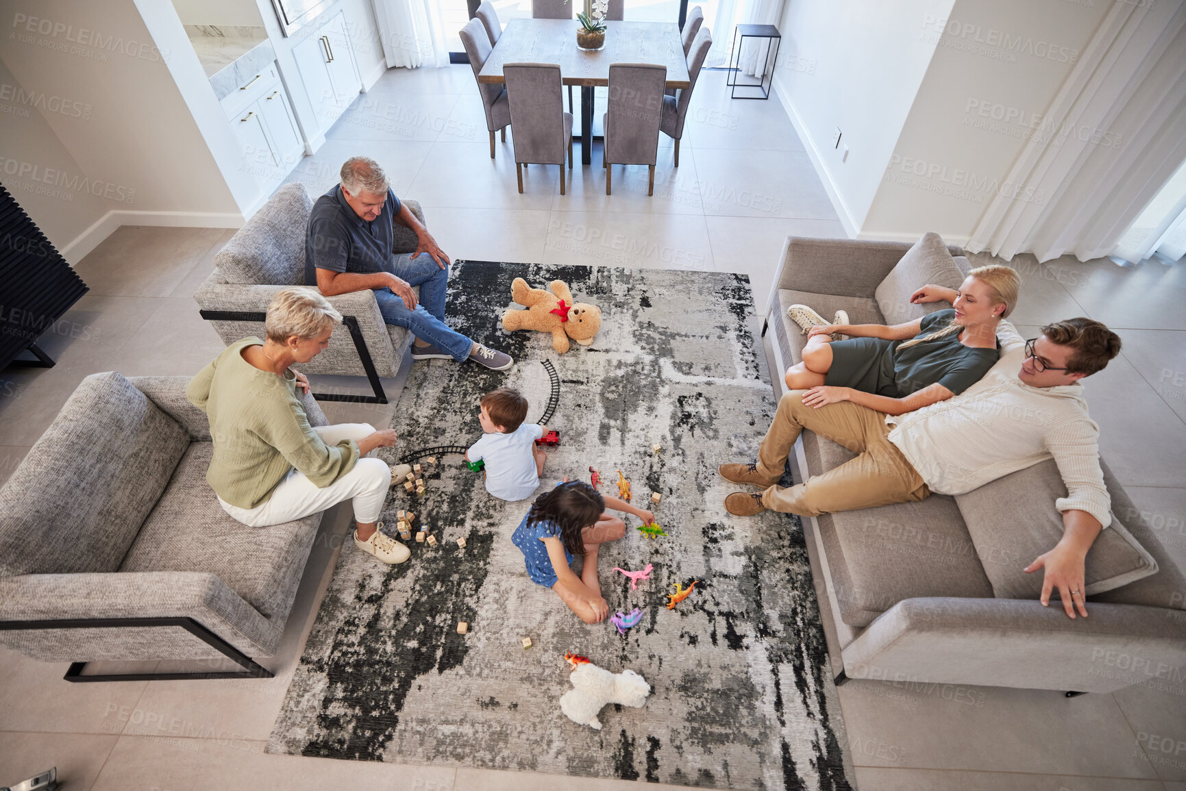 Buy stock photo Big family in living room home with parents, baby or children play on carpet for growth, development and wellness. Overhead grandmother and grandfather talking to kids for language learning in lounge