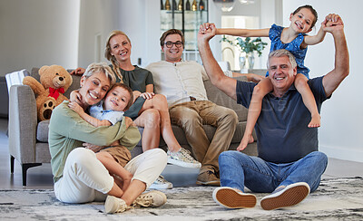Buy stock photo Happy, family and smile for love, care and playful happiness together in the living room at home. Portrait of people in joyful generations smiling and bonding fun with children and grandparents