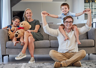 Buy stock photo Relax, family and sofa portrait in home with young parents and children bonding on the weekend. Playful, piggy back and happy people with kids enjoy cheerful time together in house living room.


