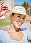 Happy, summer and a woman on holiday with hat and smile on face in the sun. Nature, sunshine and relax, girl outdoors on a tropical vacation, weekend away or time for freedom and fun in sunny weather