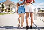 Summer, beach boardwalk and girl friends on walk in nature by the ocean during vacation. Lgbtq couple walking on a promenade along the sand and water while on tropical seaside holiday in south africa