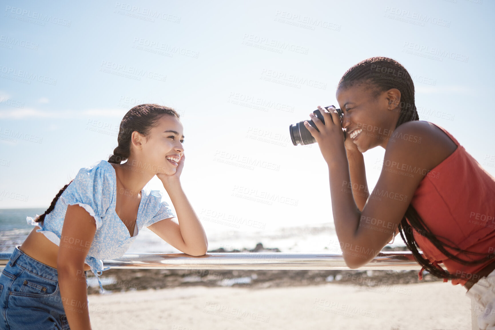 Buy stock photo Summer, photographer and friends at a beach, having fun and posing for photograph on a sea trip together. Travel, happy and women bonding on a Florida vacation, relaxed and cheerful in with a camera