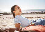 Holiday, smile and happy couple at the beach to relax while laughing at a funny joke and outdoors in summer. Gen z woman and young black man love enjoying quality time, ocean and traveling together