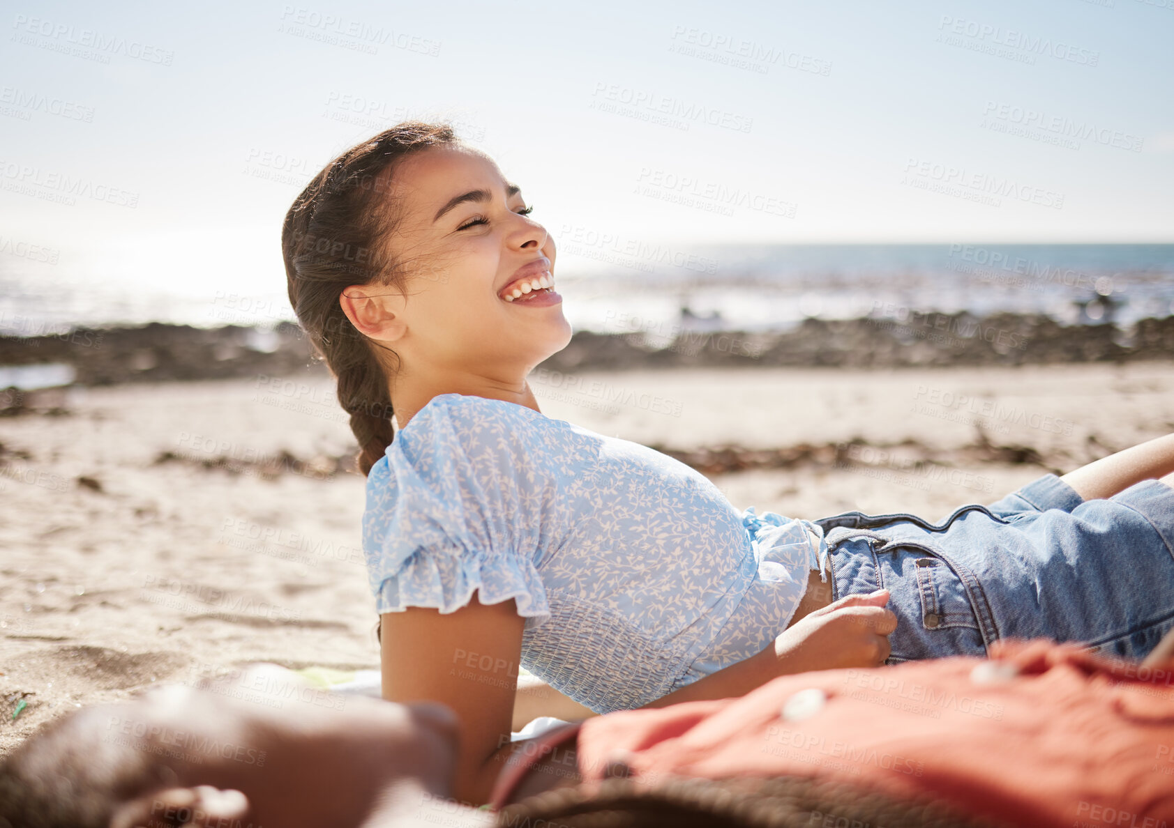 Buy stock photo Holiday, smile and friends at the beach to relax while laughing at a funny joke and outdoors trip in summer. Happy gen z girl and young black woman enjoying quality time, ocean and traveling together