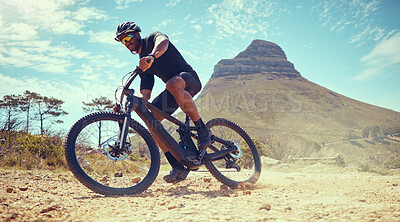 Buy stock photo Mountain bike, fitness and exercise man off road, dirt road or sand by Lions head mountain. Health, wellness and male on desert, dust or terrain track on bicycle training for cycling race in nature.