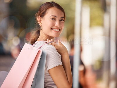 Buy stock photo Shopping, fashion and portrait of woman with shopping bags, smile and happy after buying luxury designer clothes. Retail, discount and asian girl or customer travel in street to purchase sales items