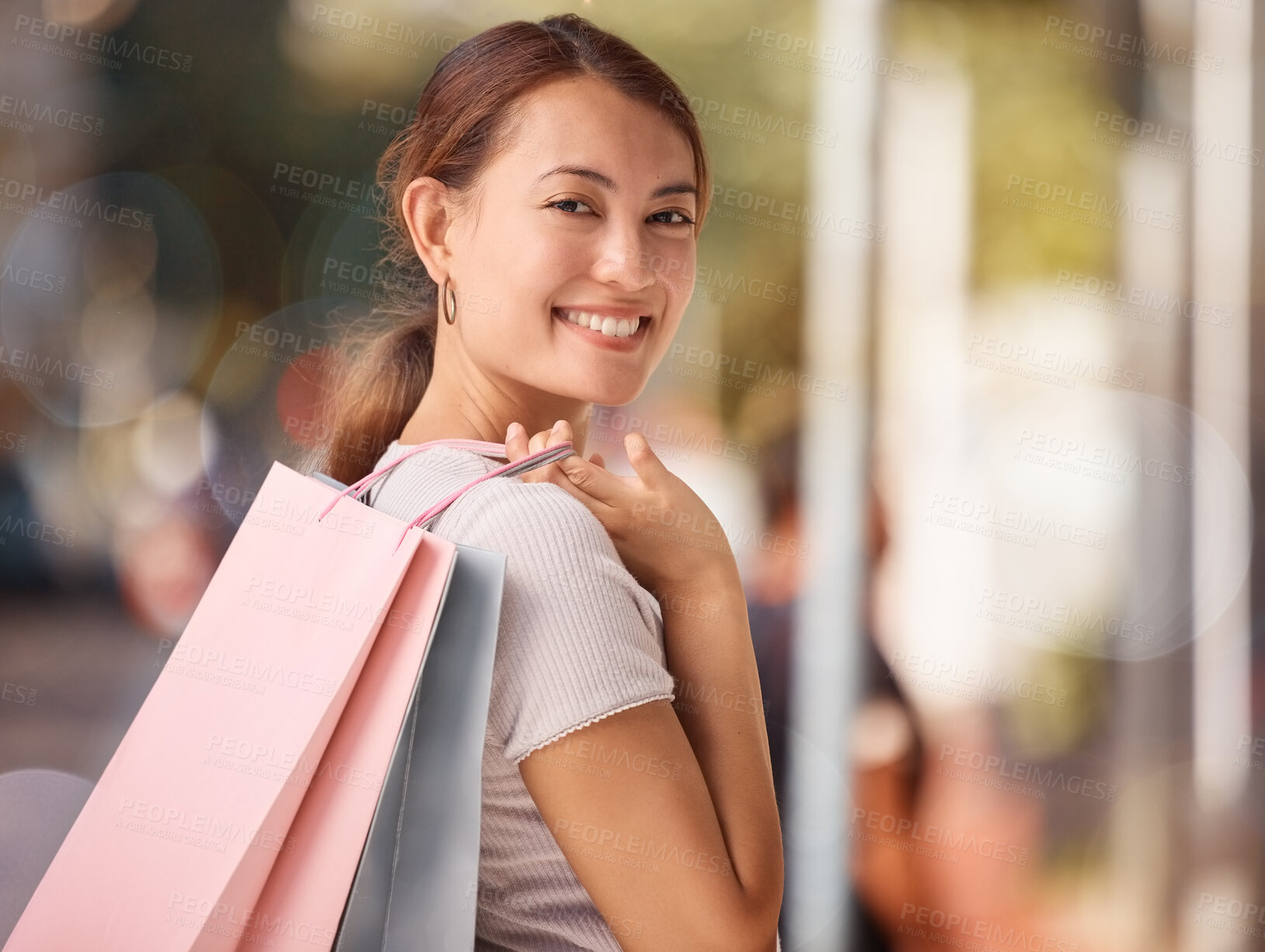 Buy stock photo Shopping, fashion and portrait of woman with shopping bags, smile and happy after buying luxury designer clothes. Retail, discount and asian girl or customer travel in street to purchase sales items