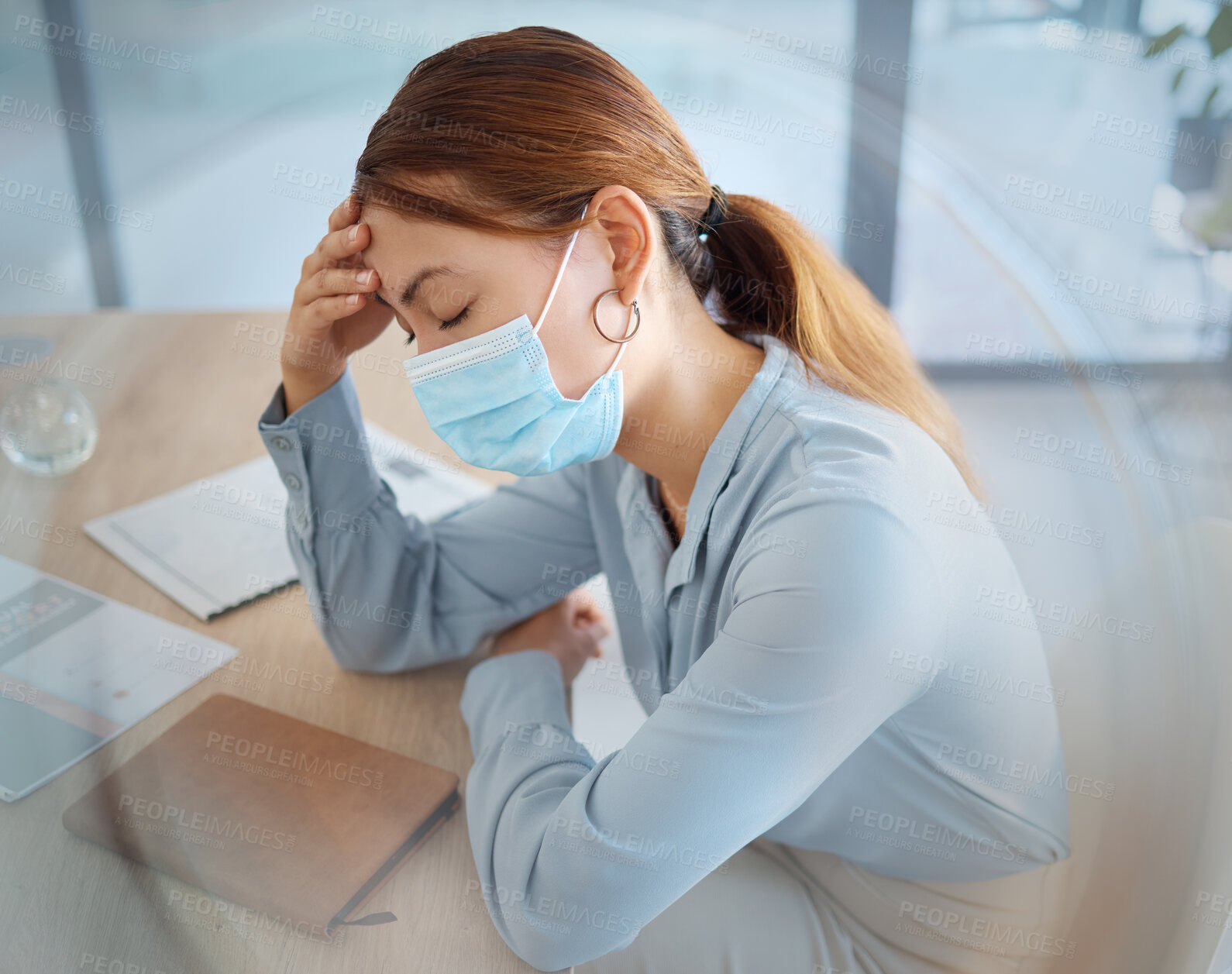 Buy stock photo Covid, headache and face mask on business woman in compliance office, corporate startup and company. Sick, anxiety and burnout worker or tired employee with stress pain from global healthcare virus