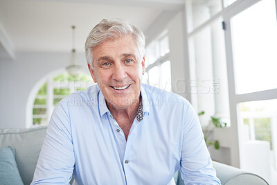 Buy stock photo Happy senior, smile and retired man sitting alone on the sofa in the living room enjoying his retirement and free time at home. Portrait of an elderly male looking at a webcam for a video call