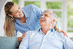 Senior man and daughter on sofa in their home, happy, smiling and bonding together. Elderly dad and woman laughing, talking and spending time after retirement. Love, family and parent and child bond