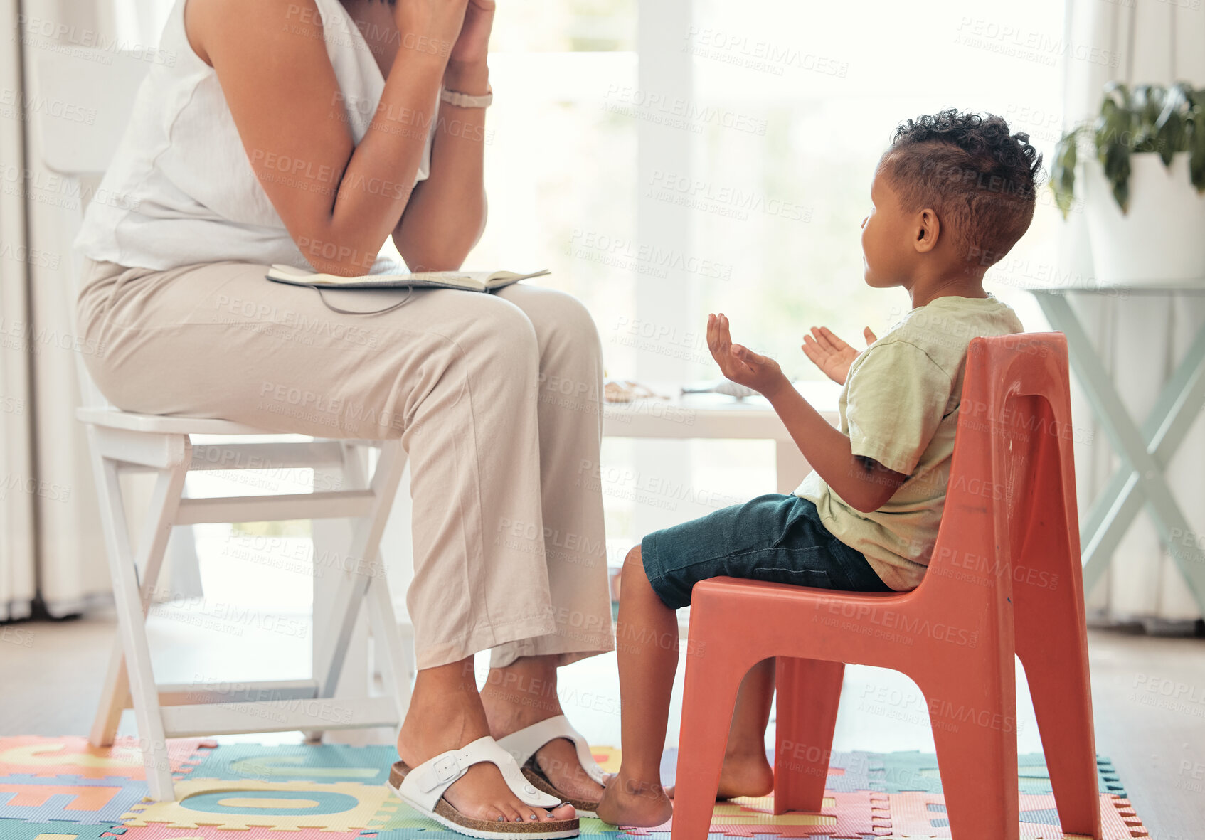 Buy stock photo Autism, education and mental health by therapist and child learning different hand sign to express feelings in living room. Teaching, speech and child development with boy and woman lesson on emotion