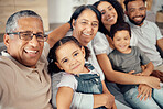Portrait of children, parents and grandparents in family home, sitting together on the sofa in living room. Happy, smiling and multicultural family posing for a selfie together. Love, bonding and joy