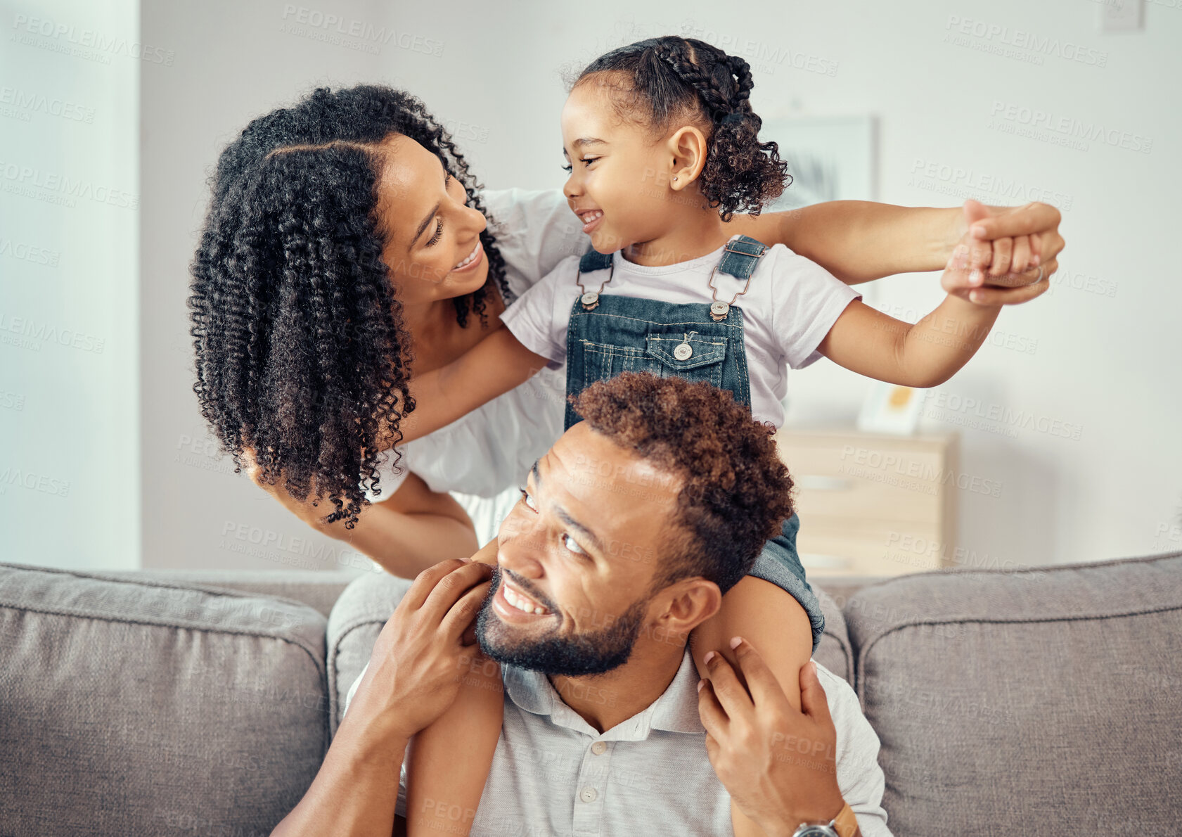 Buy stock photo Black family or mother, father and child on sofa together for happiness, love and care. Happy group of people parents or mom, dad and girl kid on living room couch for home growth development