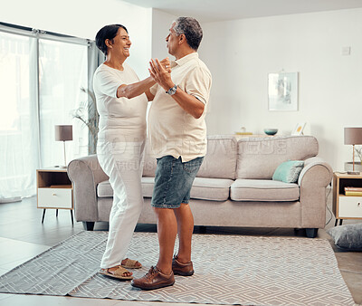 Buy stock photo Senior couple dancing in living room home for love, retirement or real estate. Dance together, celebration of marriage and elderly people smile. hug and share life with affection, freedom and care