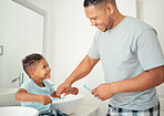 Dental, father and child brushing teeth with a toothbrush in a bathroom for healthy, wellness and oral care together. Happy young kid, boy and son showing dad a big smile for morning hygiene routine