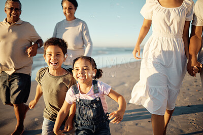 Buy stock photo Happy family, beach vacation and children running during fun active activity in summer with parents and grandparents. Laughing, bonding and chasing joy while men, women and kids playing on holiday