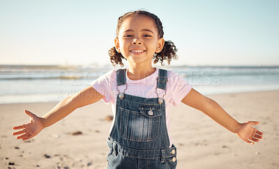 Buy stock photo Beach, happy girl child and portrait on holiday, vacation or summer trip outdoors. Carefree, smile and happiness of fun kid in Mexico ocean, sea and sandy shore travel location, earth and blue sky.
