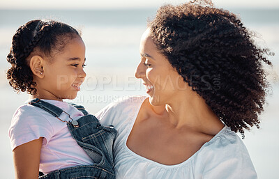 Buy stock photo Mom with child at beach smile, make eye contact and black family happiness. Black woman with girl, happy spend time as mother and daughter, on family holiday or vacation by the ocean in Brazil