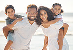 Happy family portrait, smile and beach, vacation or holiday summer trip. Mother, father and children, little boy and girl together relax on sandy ocean sea shore, bonding and love, care and coast fun
