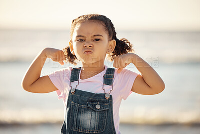 Buy stock photo Beach, summer and little girl pulling funny face and flexing on holiday in Mexico. Strong, courage and child at ocean on vacation in Cancun. Waves, sea and sand, healthy kid in nature on school break
