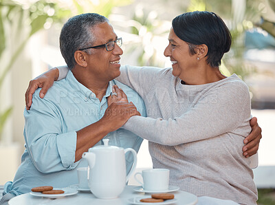 Buy stock photo Senior couple laughing, drinking coffee and bonding in backyard cafe together, relax and cheerful outdoors. Elderly man and woman enjoying retirement and their relationship, sharing a joke and snack