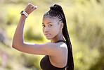Fitness, flexing and black woman with muscle in nature ready for arms training, biceps and outdoor workout in summer. Portrait, lifestyle and strong African girl power with an active female athlete 