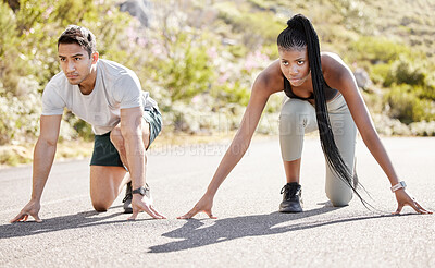 Buy stock photo Sports race, fitness couple and ready to run asphalt road with competitive, fit and active runners for outdoor workout. Asian man and black woman sitting in position to start sprint, athlete training