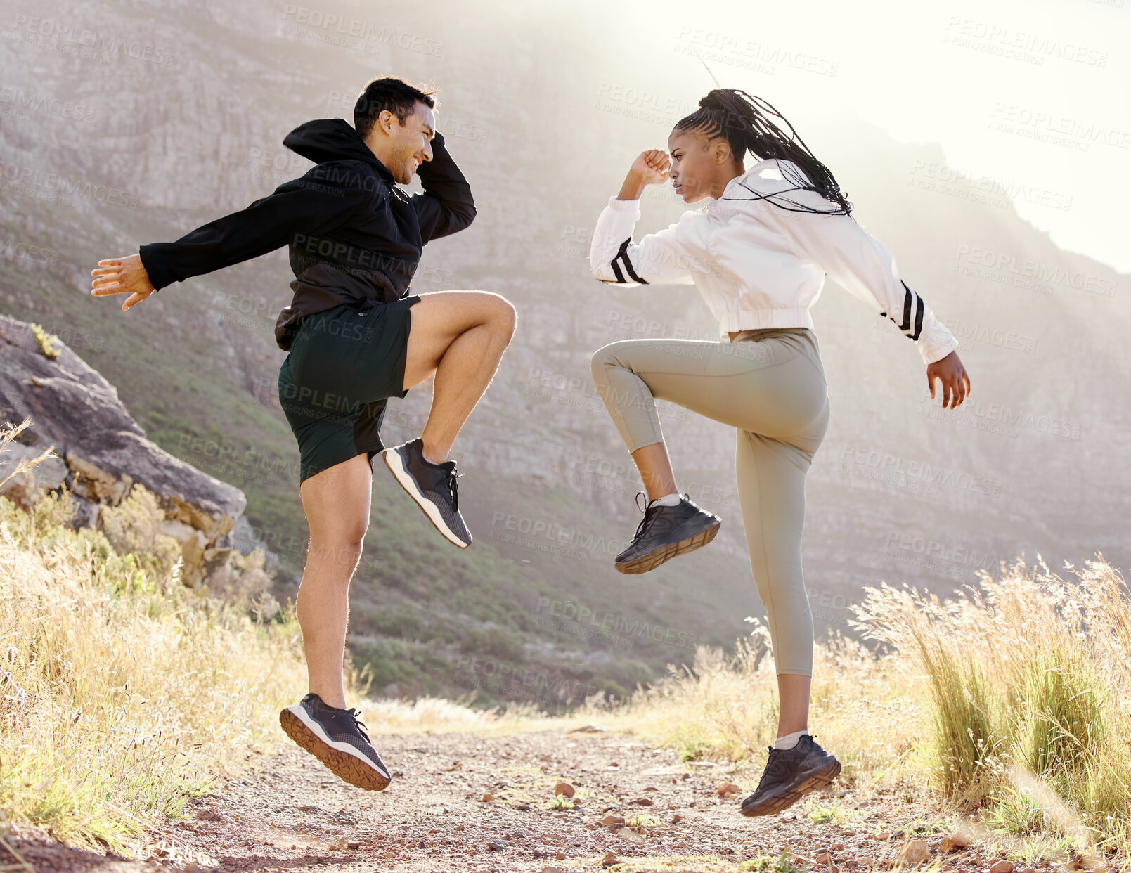 Buy stock photo Fitness, nature and couple exercise in mountain hill, jump wellness and outdoor cardio workout on dust path. Motivation, health and sport partnership or friends in sports training or active lifestyle