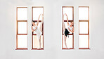 Ballet, art and dancers dancing on the windowsill at the dance academy in a practice studio. Elegant team of ballerinas stretching, training and practicing a skill for classical recital performance.