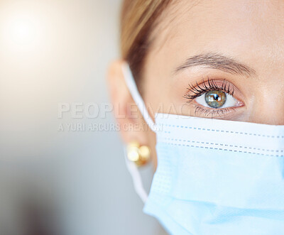 Buy stock photo Covid health, face mask and humanity with closeup of eye of young woman wearing protection, precaution and safety. Portrait of a female and healthcare against coronavirus, flu and cold in a pandemic

