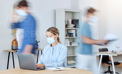Buy stock photo Business woman, busy office and covid compliance while on laptop and blur of people around her. Employees in the office during coronavirus wearing face mask and working in company after lockdown