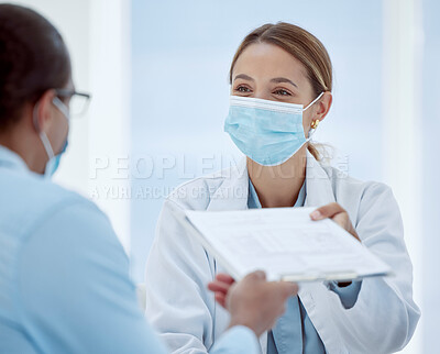Buy stock photo Doctor, woman and covid patient form for health consultation advice and records at hospital. Female healthcare nurse with mask offering document for vaccine agreement or pandemic safety regulations