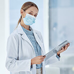 Doctor with covid face mask and a checklist for compliance, risk management and medical insurance. Portrait of a healthcare woman expert with corona virus innovation planning in a hospital or clinic
