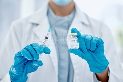 Buy stock photo Covid, vaccine and hands of a medical doctor holding the needle and syringe for an injection. Medicine, science and closeup of healthcare worker with a pharmaceutical virus treatment in a glass vial.