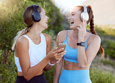 Buy stock photo Fitness music, happy nature and friends listening to radio with phone while training in summer, smile for podcast during workout and motivation for gym. Women with funny audio during outdoor exercise