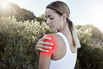 Fitness, woman and shoulder injury, pain or joint inflammation holding sore area in the nature outdoors. Injured female suffering in painful muscle tension from training, workout or exercise accident