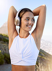 Workout woman, headphones music and fitness after a exercise training, run or health sport outdoor. Happy smile of a cardio, strong and happiness of a young female athlete ready for sports in nature