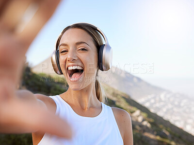 Buy stock photo Fitness, headphone music and selfie woman enjoying peaceful mountain workout rest for wellbeing. Wellness girl happy, excited and cheerful photograph break in nature landscape to relax mind.