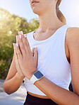 Meditation, yoga and prayer hands of woman with outdoor summer lens flare for wellness, spiritual lifestyle. Young, fitness girl with calm mindset praying and meditate for faith, self care and health