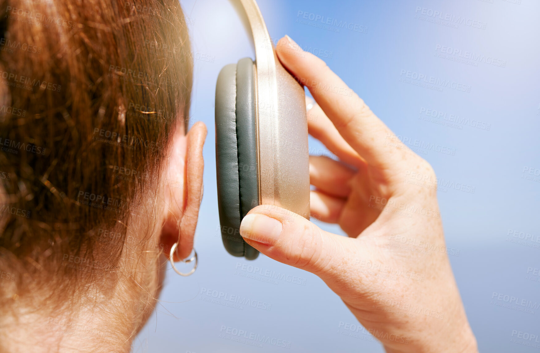 Buy stock photo Hands of woman with headphones listening to music for peace of mind, freedom and relax outdoor back view. Podcast, radio and calm girl streaming rock, disco or jazz audio song for wellness mindset