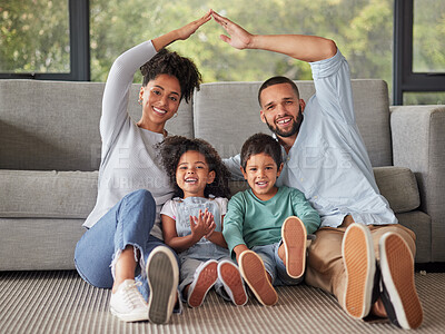 Buy stock photo Happy, family and home insurance with roof over kids for protection, family safety and care in their home. Portrait, mom and dad cover children loving, together and smile in living room on the floor 