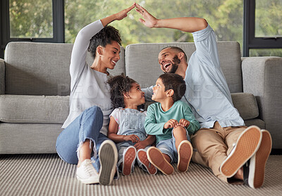 Buy stock photo Family, children and insurance with a mother and father covering their kids with a roof for safety, care and trust. House, parents and love with a girl and boy being protected by mom and dad at home