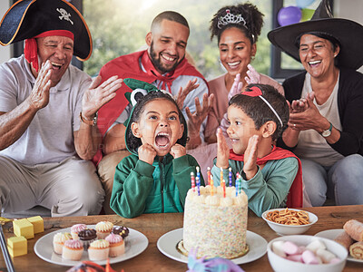 Buy stock photo Happy, birthday and party with family in costume for celebration event in living room for love, creative or halloween holiday. Excited, funny and smile with kids, parents and grandparents at home